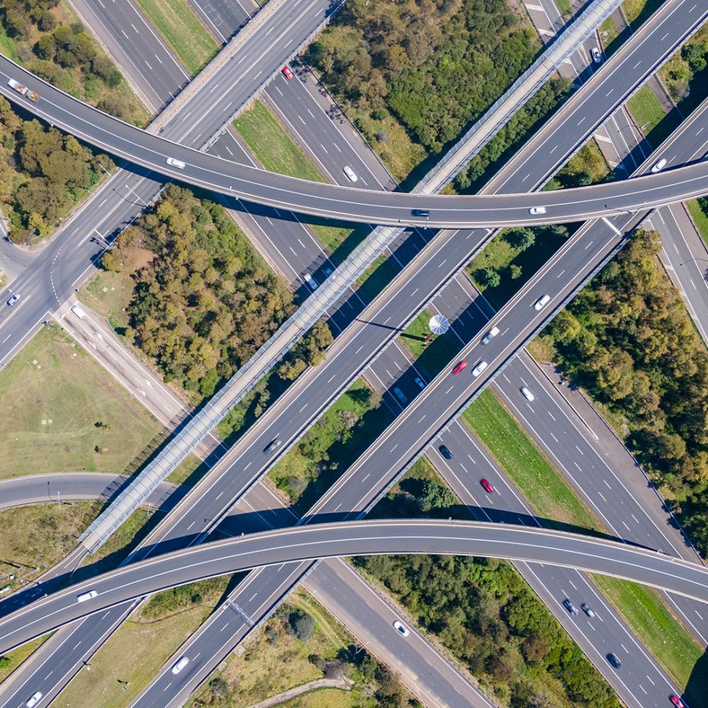 Aerial view of a complex highway interchange with multiple curving overpasses.